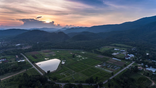 Aerial view of agricultural field against sky at night