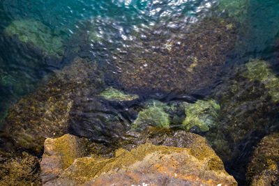 High angle view of rocks in sea