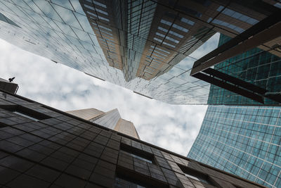 Low angle view of modern buildings against sky