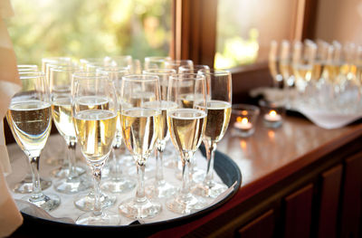 High angle view of champagne flutes on window sill