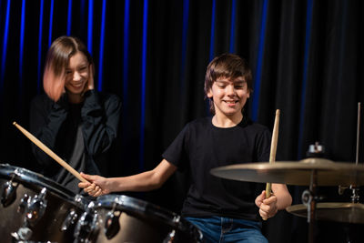 Young man playing drum