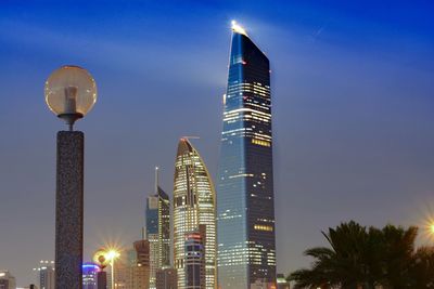 Low angle view of illuminated buildings against sky