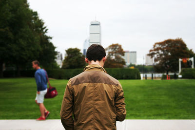 Rear view of man standing in park