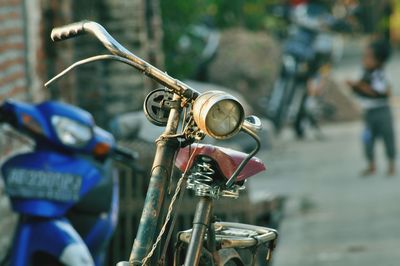 Close-up of bicycle on road