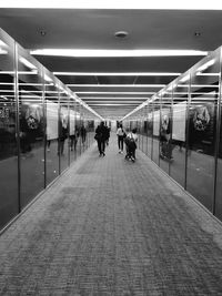 People walking in corridor of airport