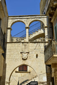 Low angle view of old building against sky