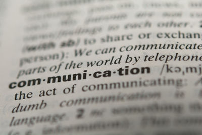 Close-up of communication text in dictionary