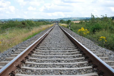 Railroad tracks against sky