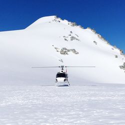 Scenic view of snowcapped mountain against sky