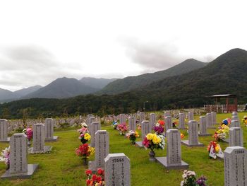 View of cemetery and mountains against sky