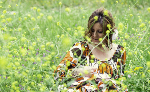 Woman by flowering plants