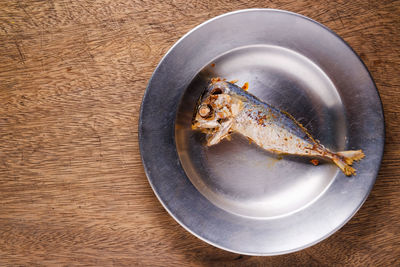 High angle view of fish in plate on table