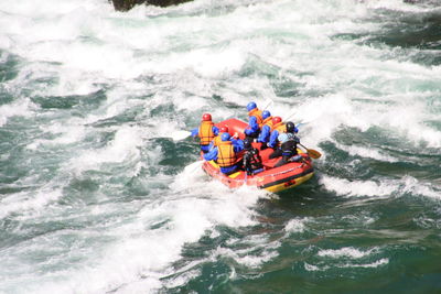 High angle view of people on boat in river