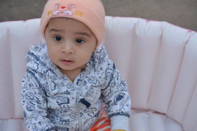 Portrait of cute baby girl at home