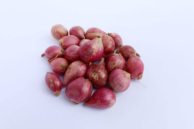 Close-up of cherries against white background