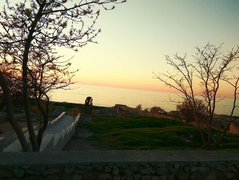 Scenic view of sea against clear sky during sunset