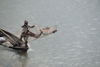 High angle view of man on boat in water