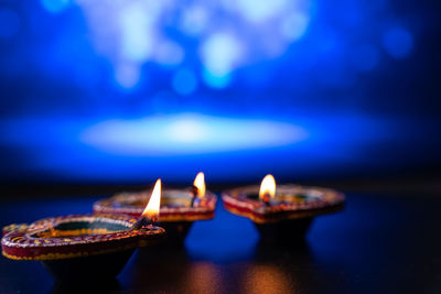 Close-up of illuminated lamp against blurred background