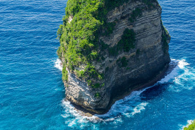 High angle view of rock formation in sea