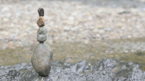 Close-up of stone stack on rock