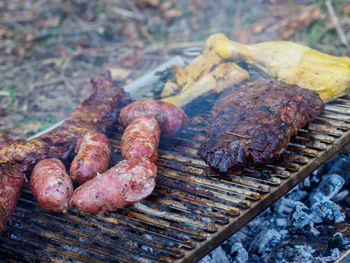 Close-up of meat on barbecue grill