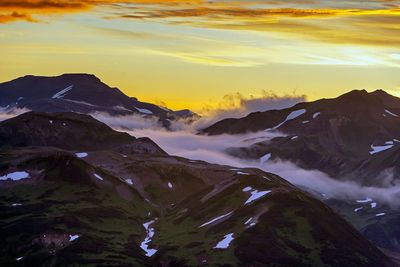 Scenic view of mountains against sky during sunset