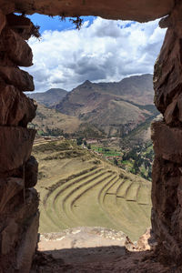 Scenic view of landscape against cloudy sky