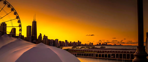 Low angle view of silhouette buildings against sky during sunset ,chicago city,usa