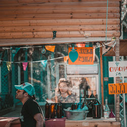 People in restaurant at market