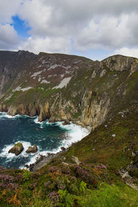 Scenic view of river flowing through mountains