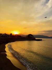 Scenic view of sea against sky during sunset