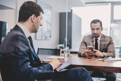 Portrait of businessman working at office