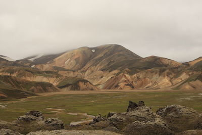 Scenic view of rocky mountains against sky