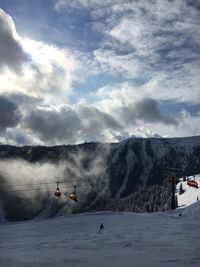 Scenic view of snow covered landscape against sky