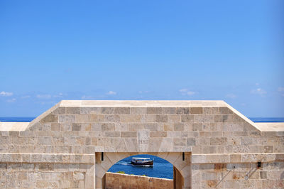 Low angle view of building against blue sky