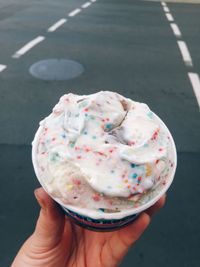 Hand holding ice cream cone
