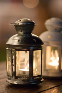 Close-up of illuminated lantern on table