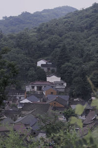 High angle view of townscape against mountain