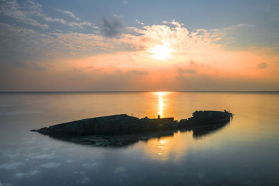 Scenic view of sea against sky during sunset