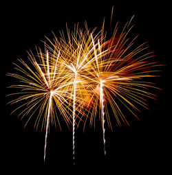 Low angle view of firework display against sky at night