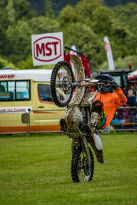 Close-up of bicycle toy on field