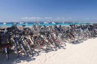 Panoramic view of people on beach against sky