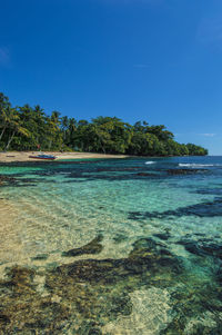 Scenic view of sea against clear blue sky