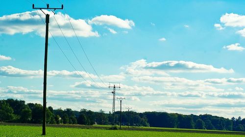 Wind turbines on grassy field