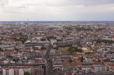 Aerial view of cityscape against sky