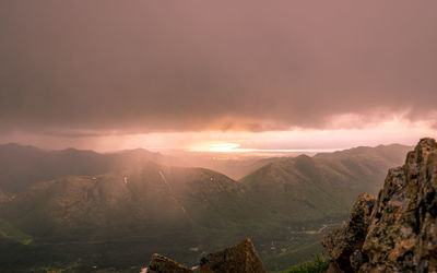 Scenic view of mountains against sky during sunset