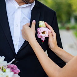 Midsection of woman holding bouquet