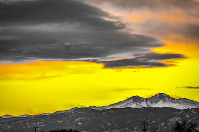 Scenic view of yellow mountain against sky during sunset