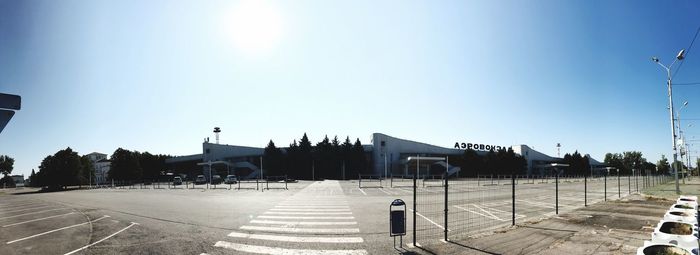 View of street against clear blue sky