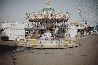 Carousel against sky in amusement park